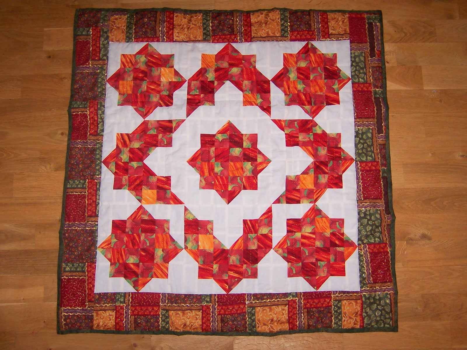 Crimson Star Medallion, handmade quilt by Keri