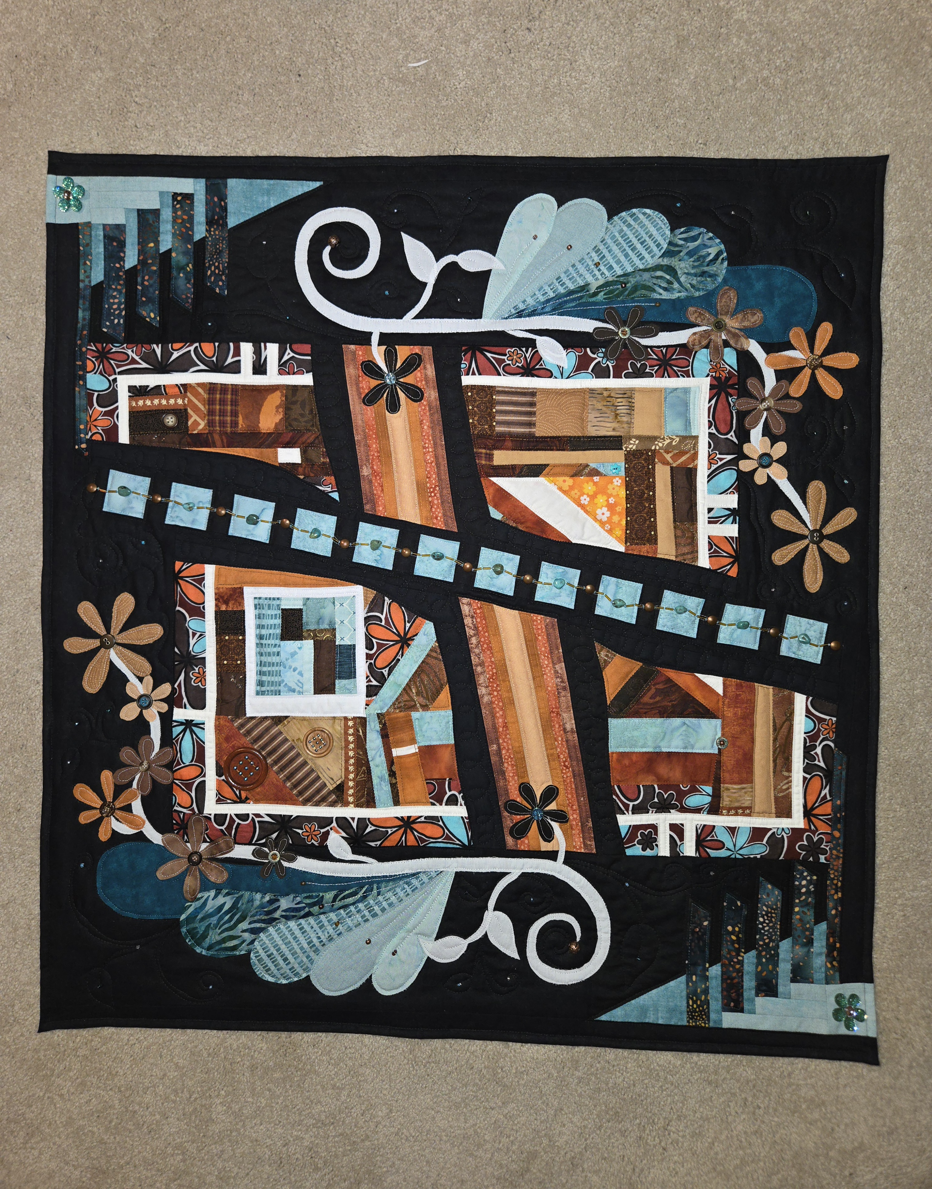 Handmade black, turquoise, rust and floral art quilt by CULCITA by Keri